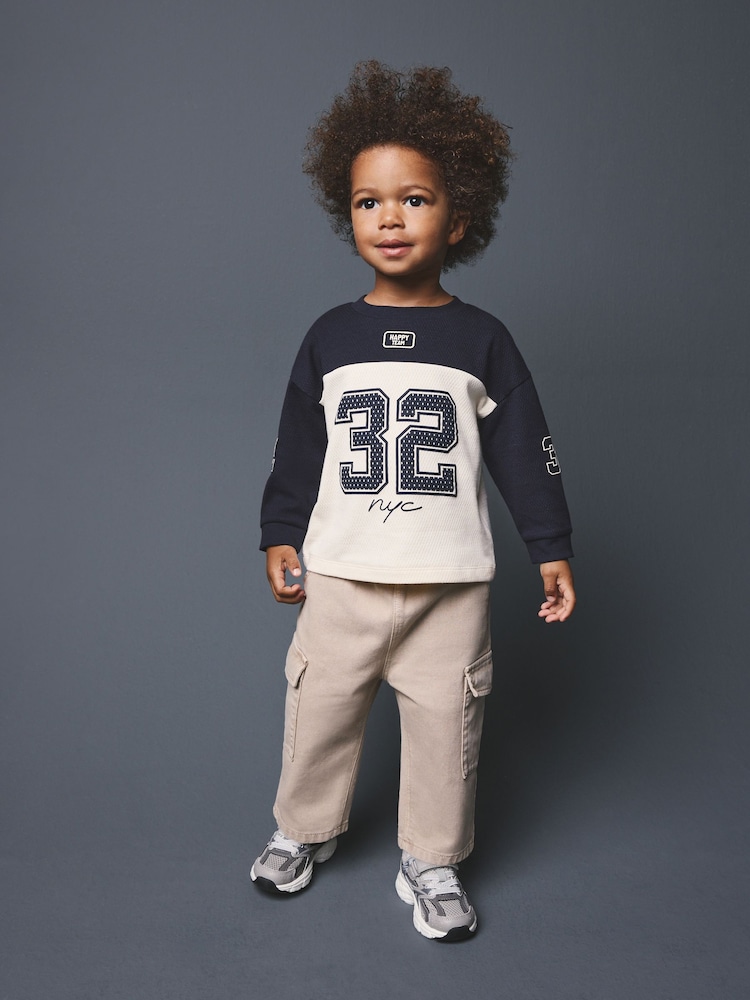 Navy Varsity Colourblock Long Sleeve Back Graphic T-Shirt (3mths-10yrs) - Image 1 of 3 Navy Varsity Colourblock Long Sleeve Back Graphic T-Shirt (3mths-10yrs) - Image 1 of 3