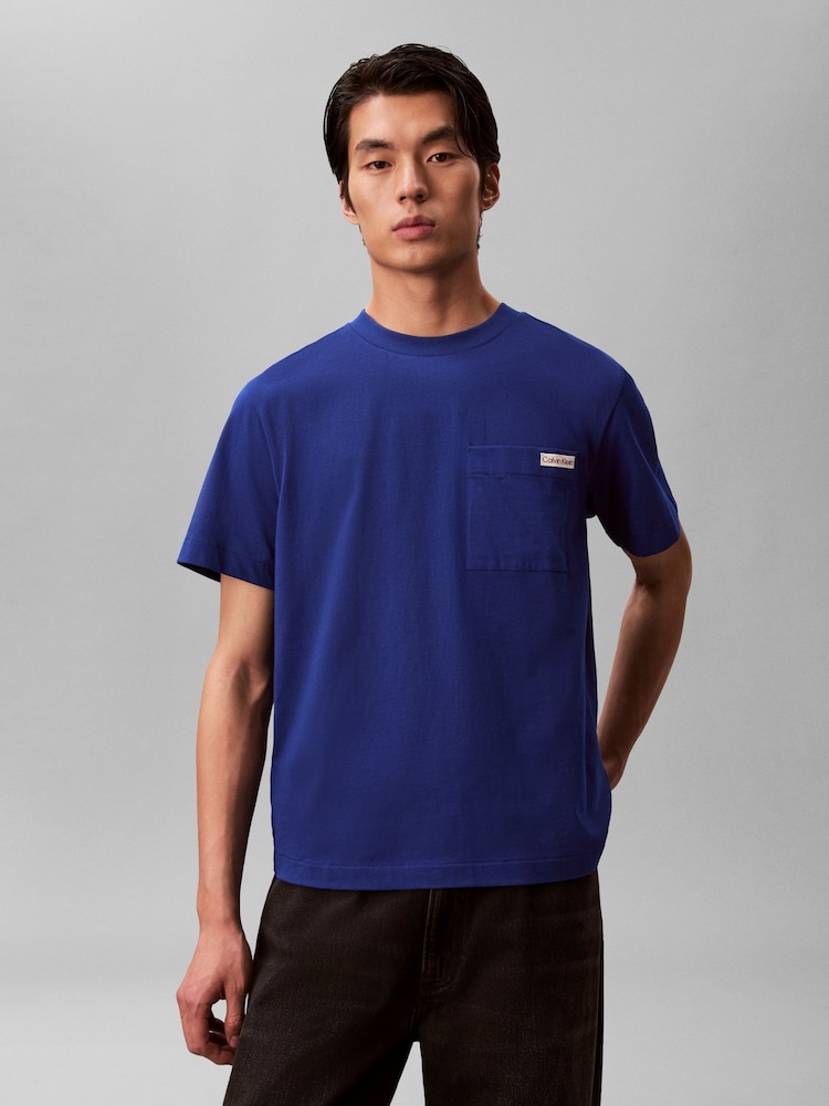 Calvin Klein Blue Chest Pocket Badge T-Shirt - Image 1 of 5 Calvin Klein Blue Chest Pocket Badge T-Shirt - Image 1 of 5