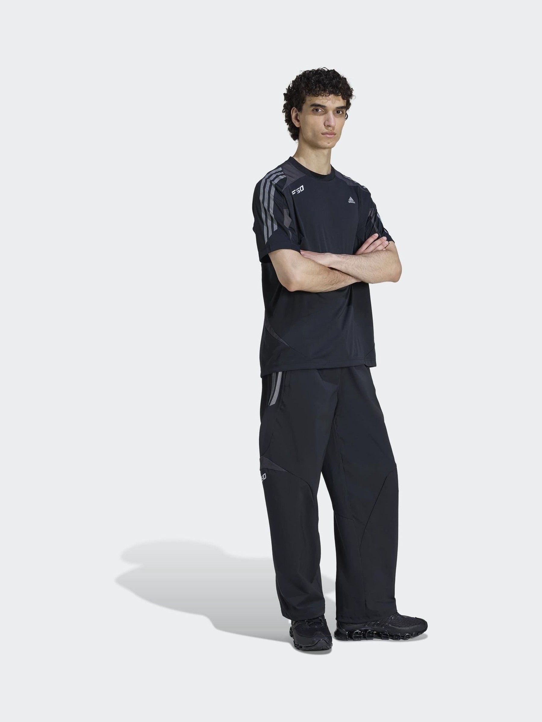 Buy adidas Originals Black F50 Loose Striped Tracksuit Bottoms