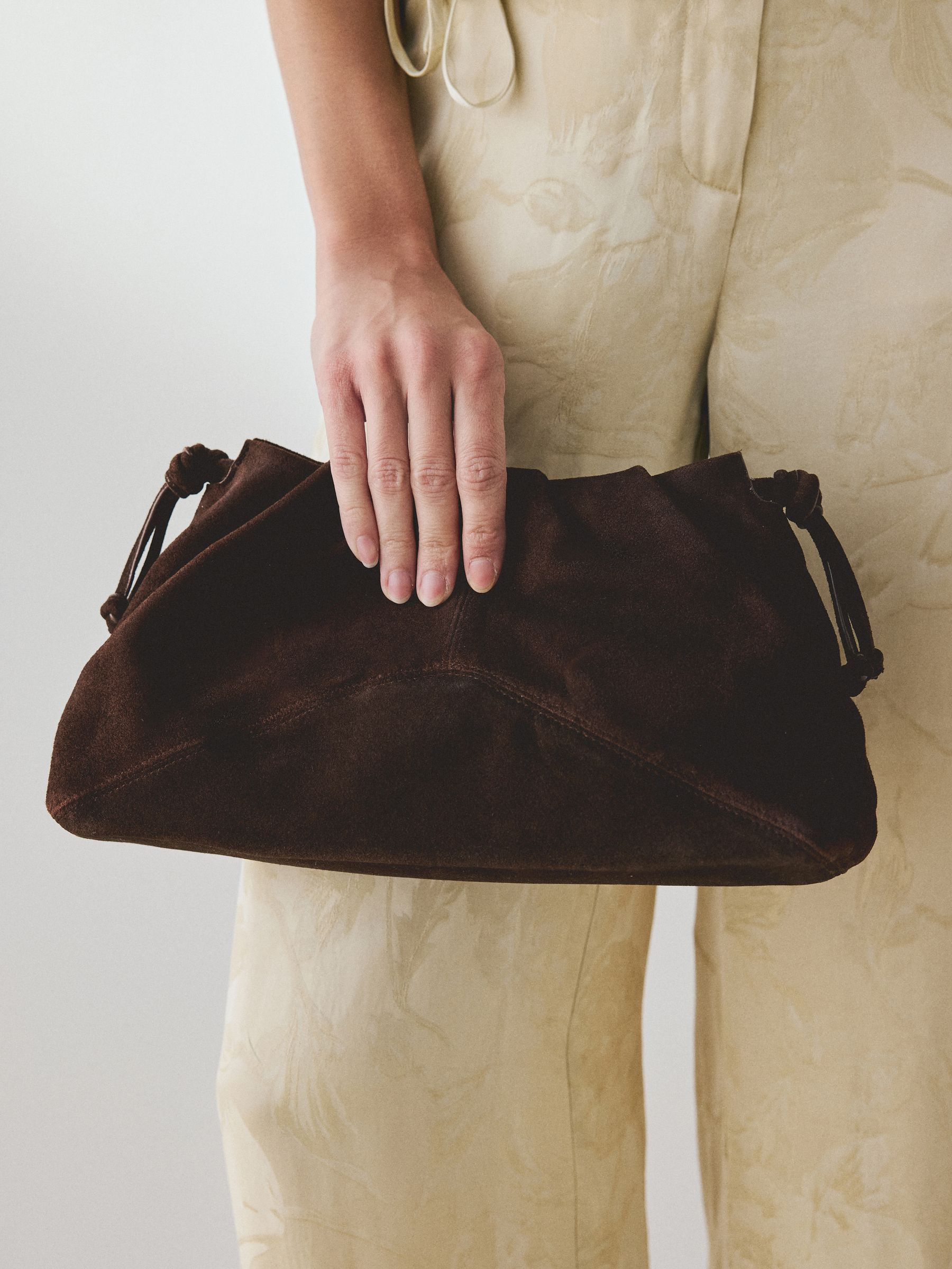 Buy Chocolate Brown Suede Ruched Clutch Bag from Next USA