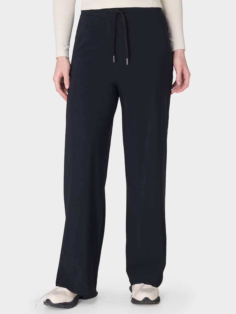 Sweaty Betty Black Explorer Wide Leg Printed Side Stripe Trousers - Image 1 of 7 Sweaty Betty Black Explorer Wide Leg Printed Side Stripe Trousers - Image 1 of 7
