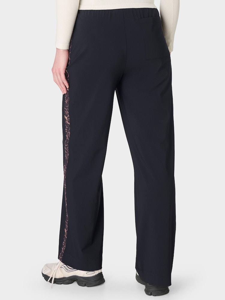 Sweaty Betty Black Explorer Wide Leg Printed Side Stripe Trousers - Image 2 of 7 Sweaty Betty Black Explorer Wide Leg Printed Side Stripe Trousers - Image 2 of 7