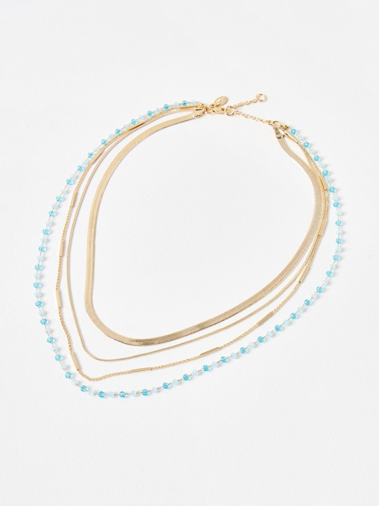 Oliver Bonas Blue & Gold Tone Bea Beaded Layered Chain Necklace - Image 1 of 4 Oliver Bonas Blue & Gold Tone Bea Beaded Layered Chain Necklace - Image 1 of 4