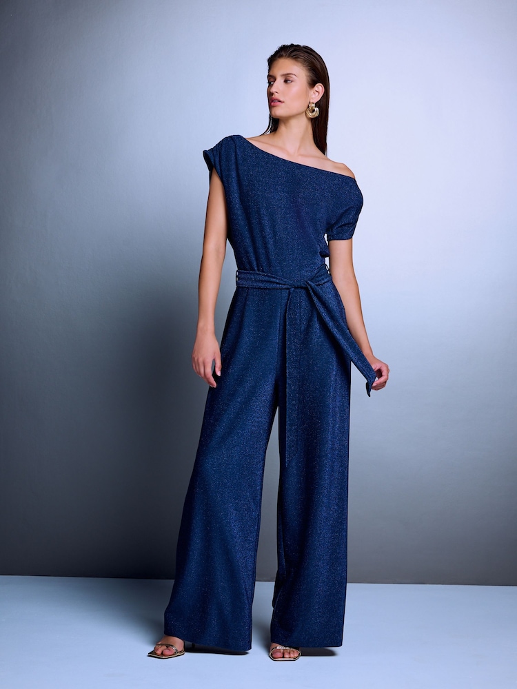 Navy Blue Off Shoulder Asymetric Tie Waist Sparkle Jersey Jumpsuit - Image 2 of 8 Navy Blue Off Shoulder Asymetric Tie Waist Sparkle Jersey Jumpsuit - Image 2 of 8
