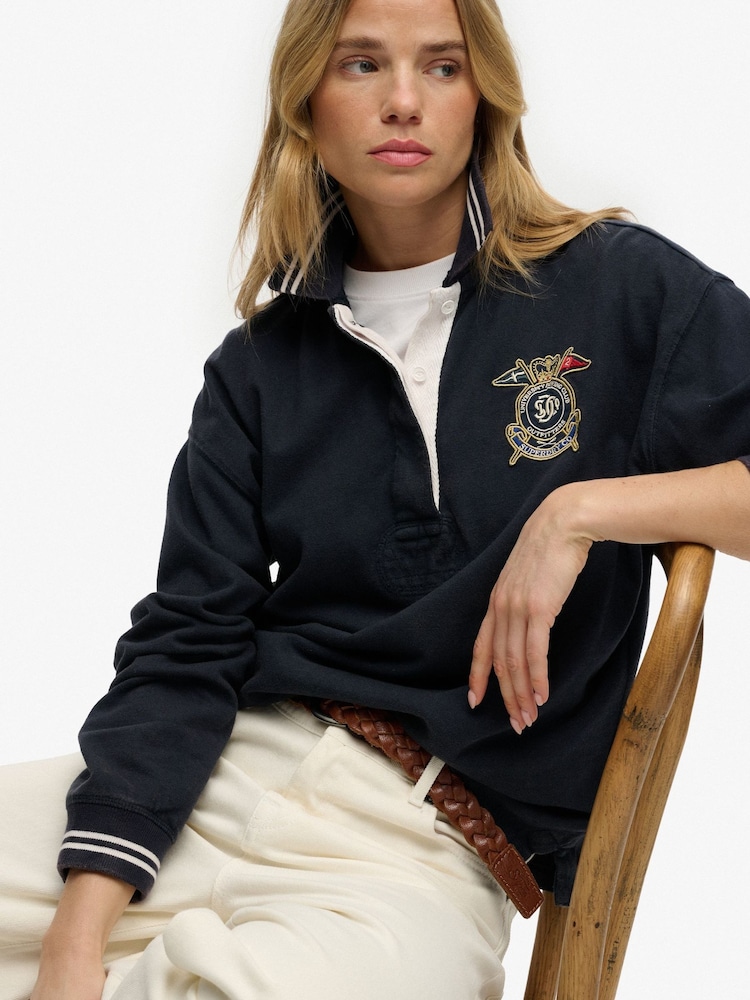 أزرق - بلوزة رغبي بشعار Crest من Superdry - Image 1 of 5 أزرق - بلوزة رغبي بشعار Crest من Superdry - Image 1 of 5