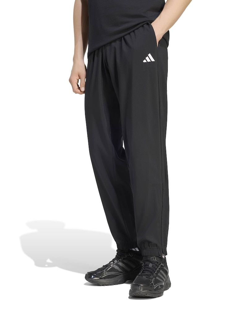 adidas Black Essentials Small Logo Stanford Lite Woven Tapered Cuffed Pants - Image 1 of 6 adidas Black Essentials Small Logo Stanford Lite Woven Tapered Cuffed Pants - Image 1 of 6
