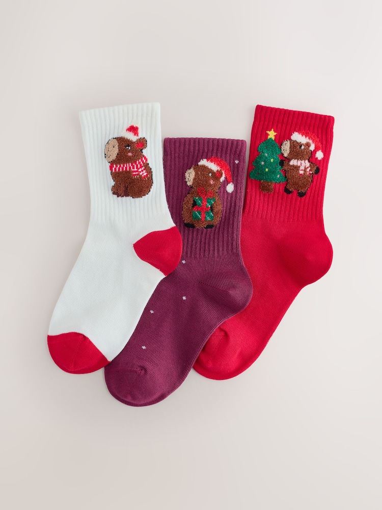 Red, White and Blue Cotton Rich Christmas Capybara Character Ankle Socks 3 Pack - Image 1 of 3 Red, White and Blue Cotton Rich Christmas Capybara Character Ankle Socks 3 Pack - Image 1 of 3