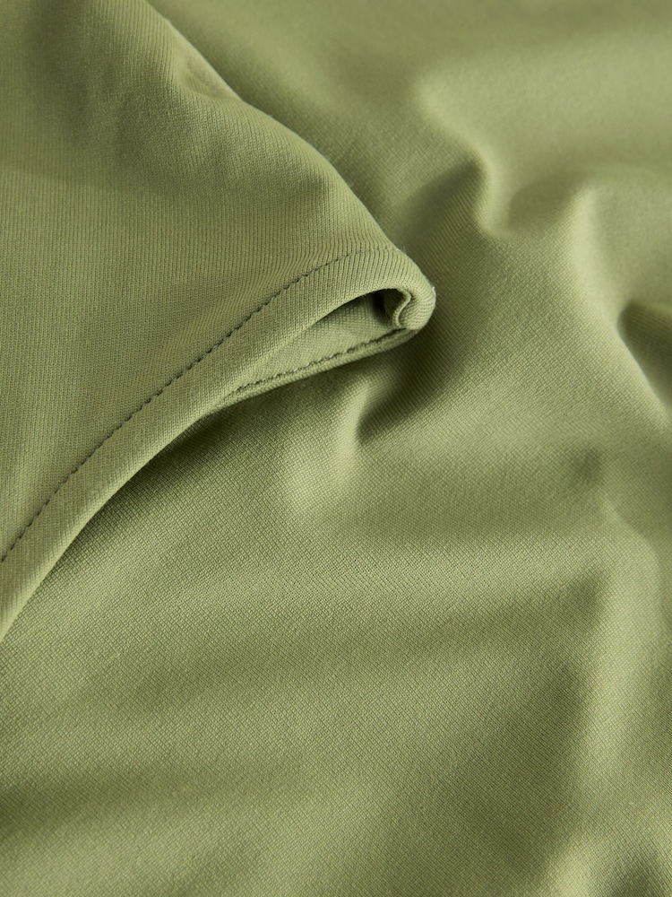 Sage Green Slinky Soft Touch Asymmetric Hardware Short Sleeve Top - Image 8 of 8 Sage Green Slinky Soft Touch Asymmetric Hardware Short Sleeve Top - Image 8 of 8