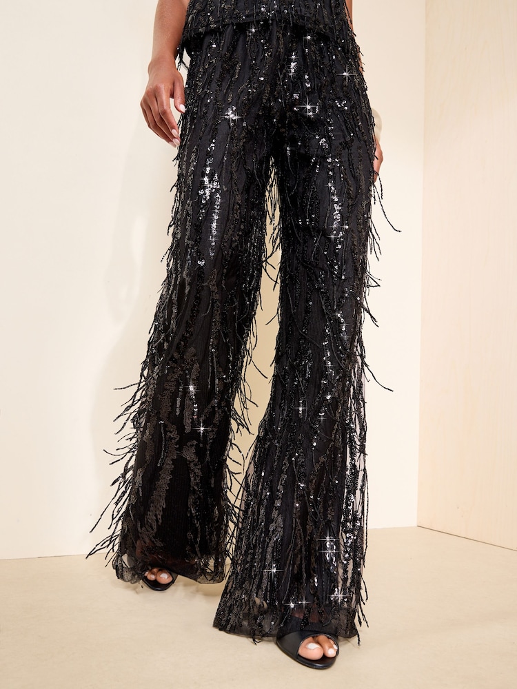 Friends Like These X Mollie King Black Sequin Fringe Tassel Wide Leg Trousers - Image 1 of 4 Friends Like These X Mollie King Black Sequin Fringe Tassel Wide Leg Trousers - Image 1 of 4