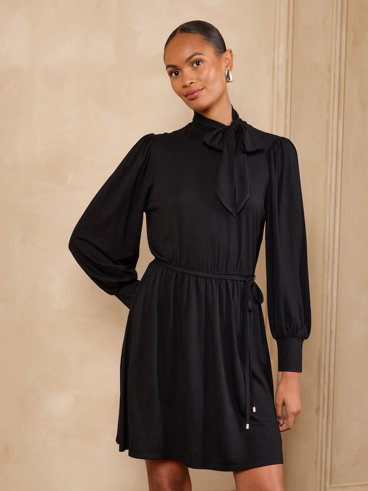 Love & Roses Black Tie Neck Jersey Skater Dress - Image 1 of 5 Love & Roses Black Tie Neck Jersey Skater Dress - Image 1 of 5