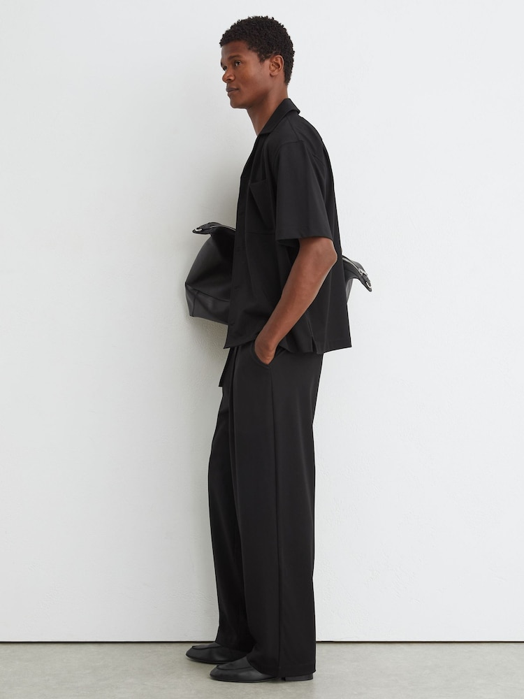 Reiss Black Walker Belted Relaxed-Fit Pleated Trousers - Image 1 of 7 Reiss Black Walker Belted Relaxed-Fit Pleated Trousers - Image 1 of 7
