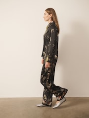 Black Precious Ditsy - CERENE Hose mit weitem Bein aus Satin mit Floralprint - Bild 3 von 11