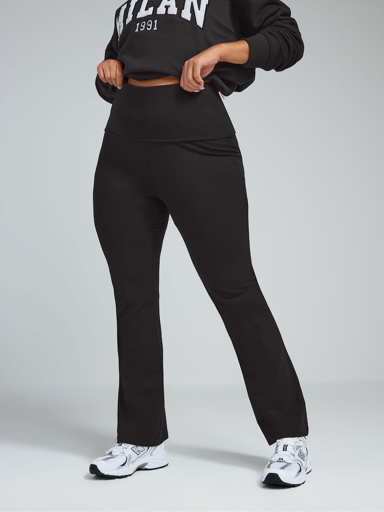 Yours Curve Black Limited Fold Over Kick Flare Leggings - Image 1 of 4 Yours Curve Black Limited Fold Over Kick Flare Leggings - Image 1 of 4