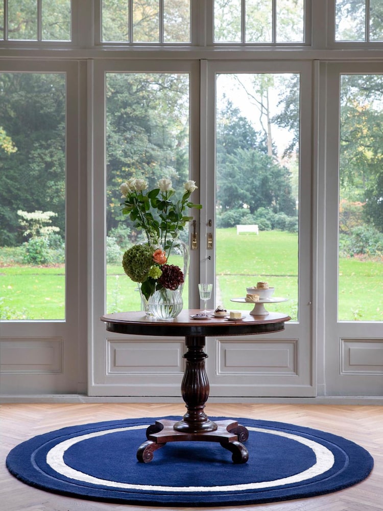 Laura Ashley Navy Lewes Border Circle Rug - Image 1 of 4