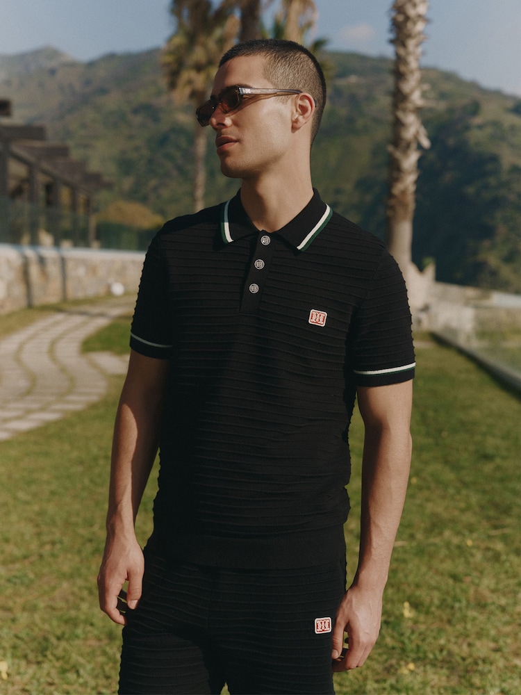 MAUVAIS Black Riviera Knit Rib Polo Shirt - Image 1 of 7 MAUVAIS Black Riviera Knit Rib Polo Shirt - Image 1 of 7