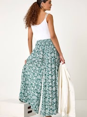 Roman Green Floral Leaf Shirred Palazzo Stretch Trousers - Image 1 of 5