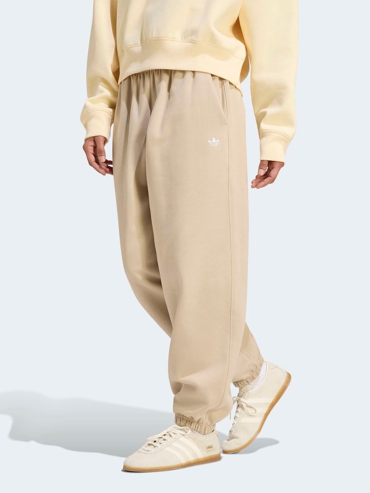 adidas Originals Cream Essentials Loose Fleece Joggers - Image 1 of 6 adidas Originals Cream Essentials Loose Fleece Joggers - Image 1 of 6
