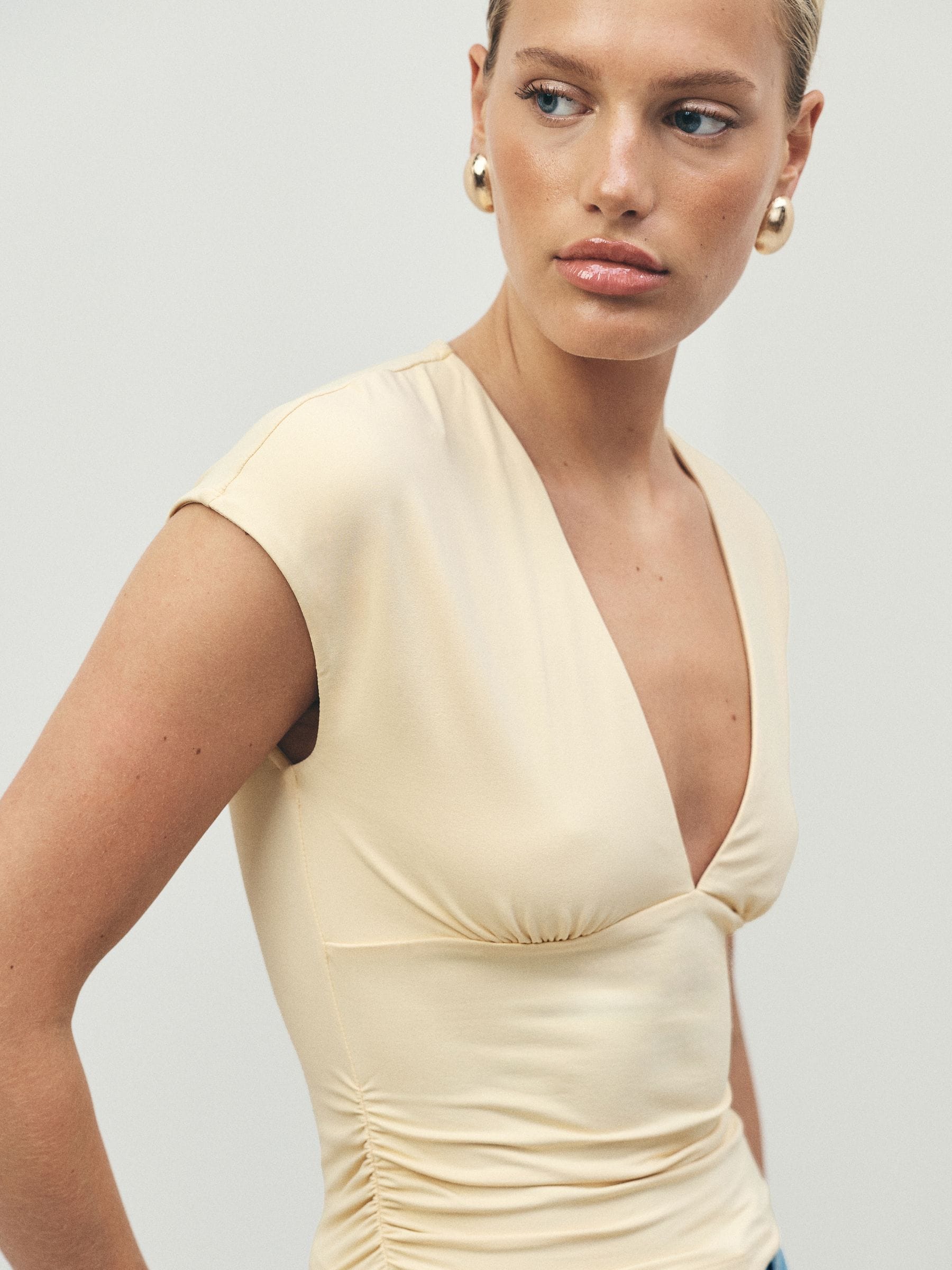 Buy Yellow Soft Touch Slinky V-Neck Ruched Short Sleeve Top from