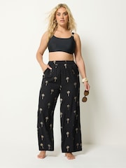 Yours Curve Black Foil Palm Tree Beach Trousers - Image 1 of 5
