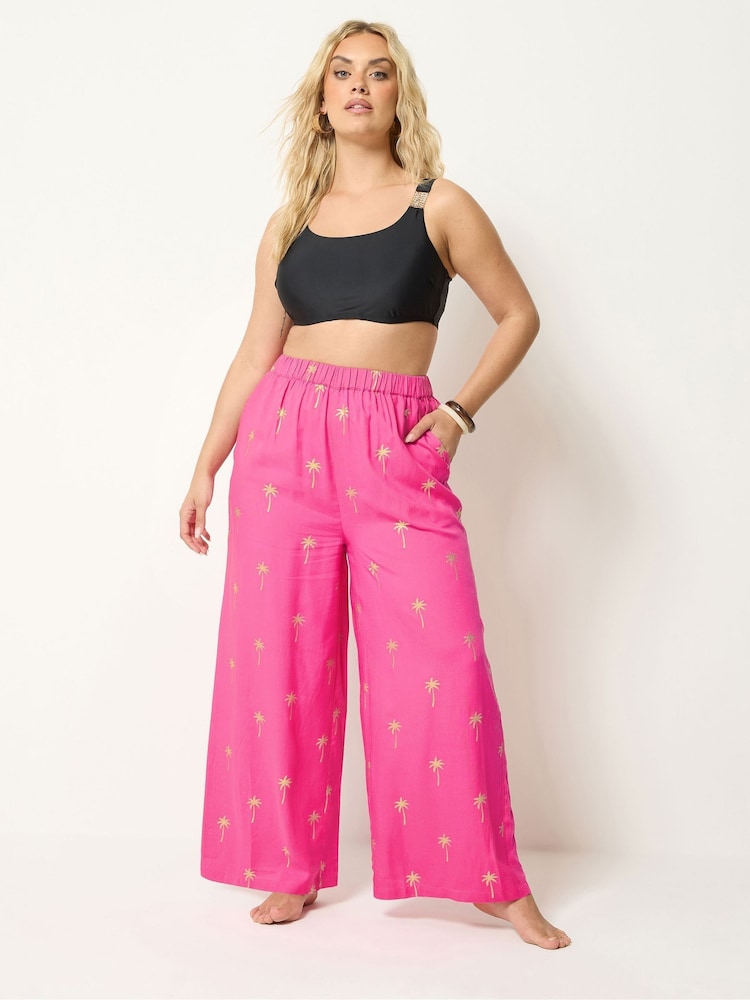 Yours Curve Pink Foil Palm Tree Beach Trousers - Image 1 of 5 Yours Curve Pink Foil Palm Tree Beach Trousers - Image 1 of 5