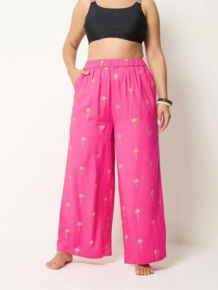 Yours Curve Pink Foil Palm Tree Beach Trousers - Image 2 of 5 Yours Curve Pink Foil Palm Tree Beach Trousers - Image 2 of 5