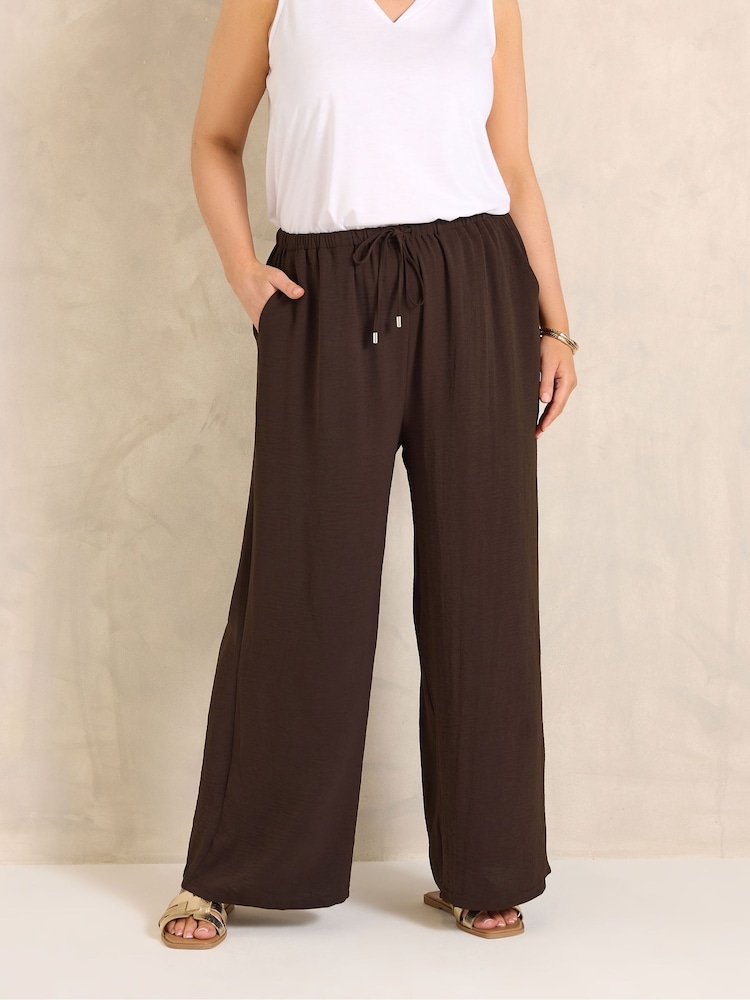 Evans Brown Short Pull On Crepe Trousers - Image 1 of 5 Evans Brown Short Pull On Crepe Trousers - Image 1 of 5