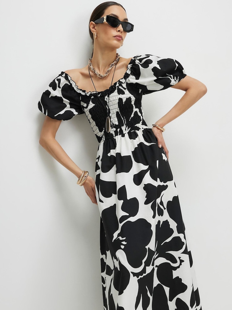 فستان متوسط الطول بأكمام منفوخة وتصميم مجمّع مزيّن بالزهور من River Island - Image 4 of 4