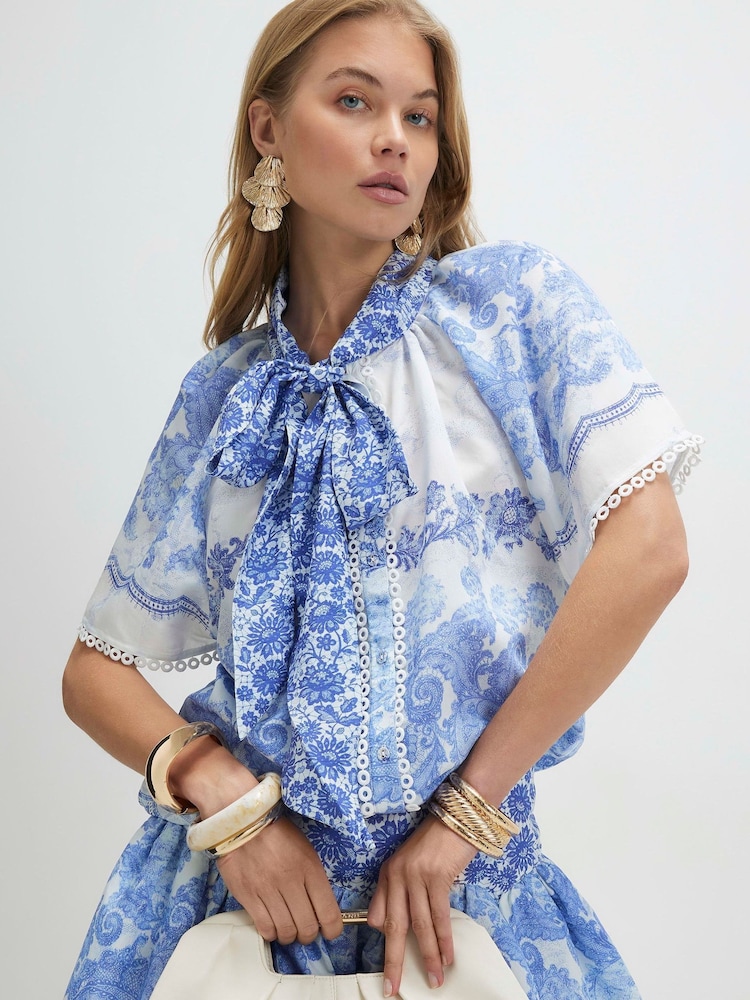 River Island Blue Cabbages and Roses Short Sleeve Printed Tie Neck Blouse - Image 1 of 4