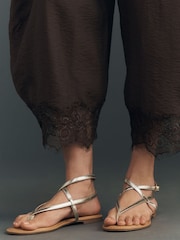 Anthropologie Cropped Lace-Hem Brown Trousers - Image 4 of 4