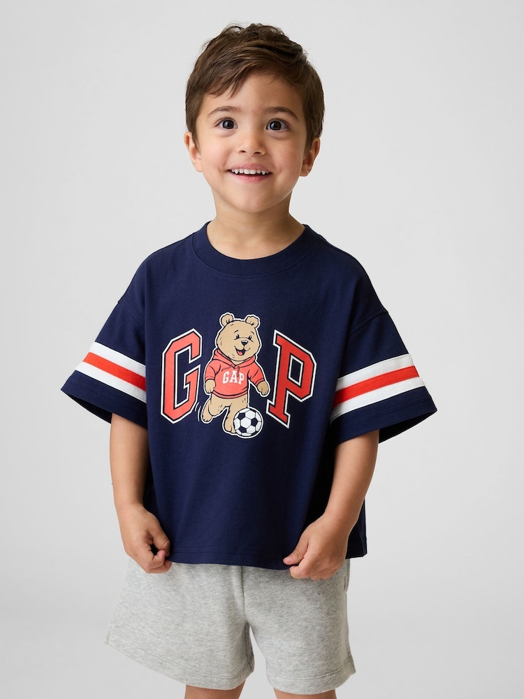 Gap Navy Brannan Bear Varsity Graphic Logo Short Sleeve T-Shirt (6mths-5yrs) - Image 1 of 4 Gap Navy Brannan Bear Varsity Graphic Logo Short Sleeve T-Shirt (6mths-5yrs) - Image 1 of 4