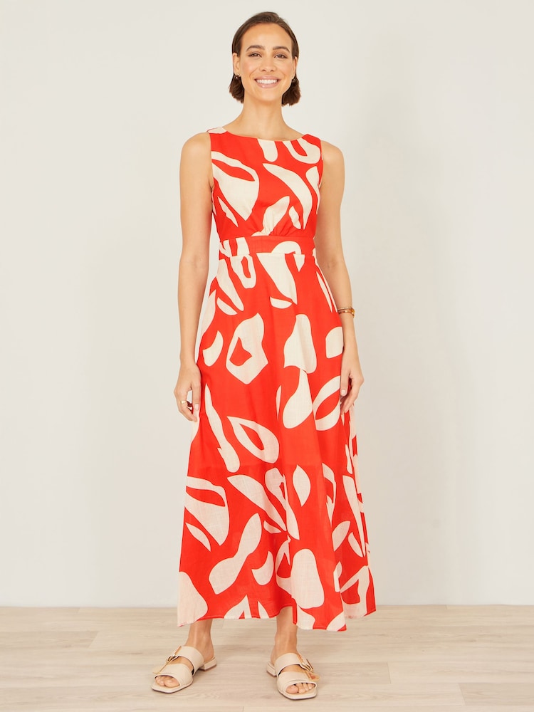 برتقالي - فستان ماكسي مزين بربطة خلفية وطبعات تجريدية مصنوع من القطن من Yumi - Image 1 of 5