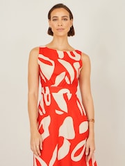 برتقالي - فستان ماكسي مزين بربطة خلفية وطبعات تجريدية مصنوع من القطن من Yumi - Image 4 of 5