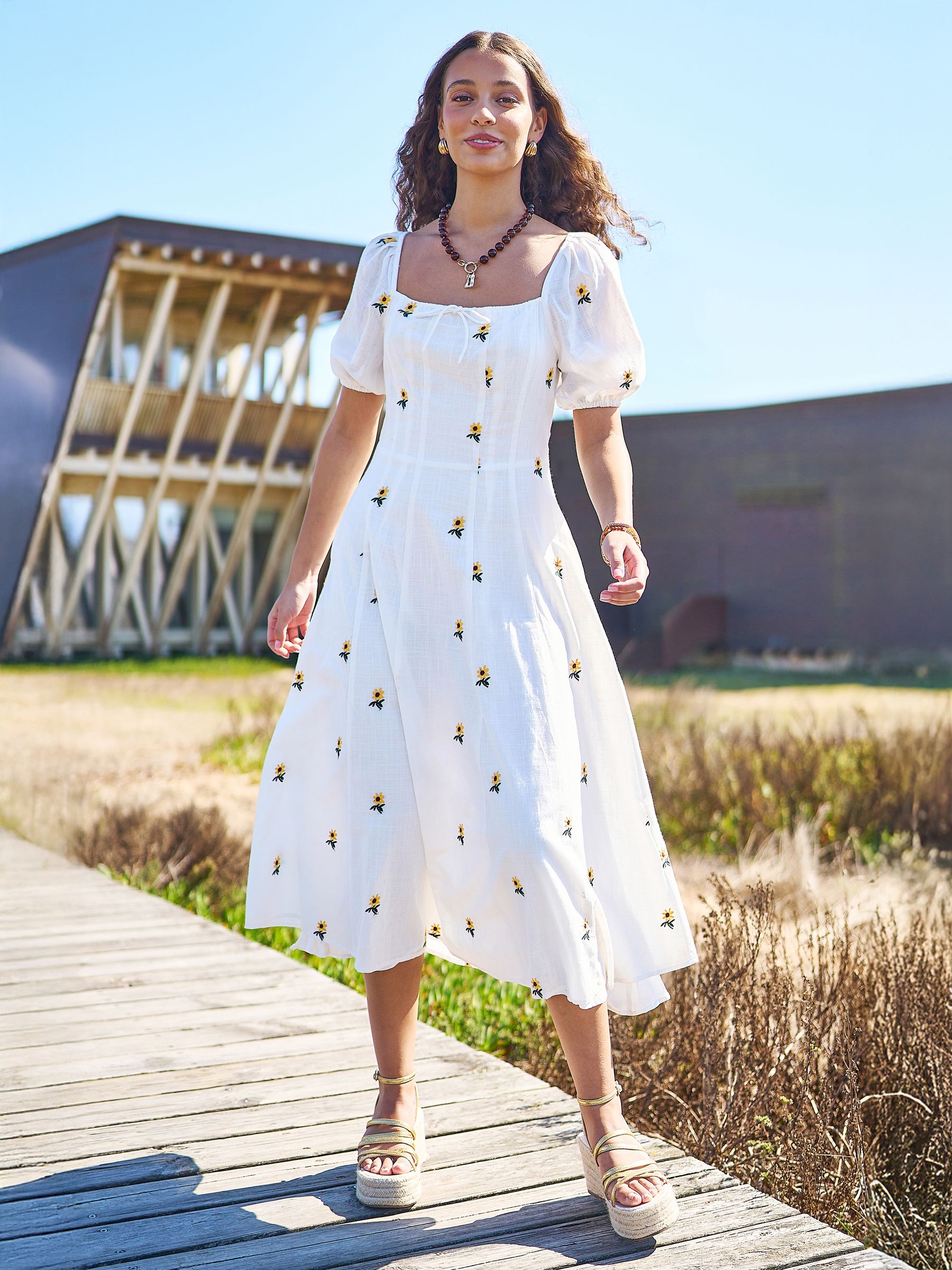 A　Sunflower-Printed Midi Dress Buy Yumi White Cotton Sunflower Embroidered Midi Dress from the