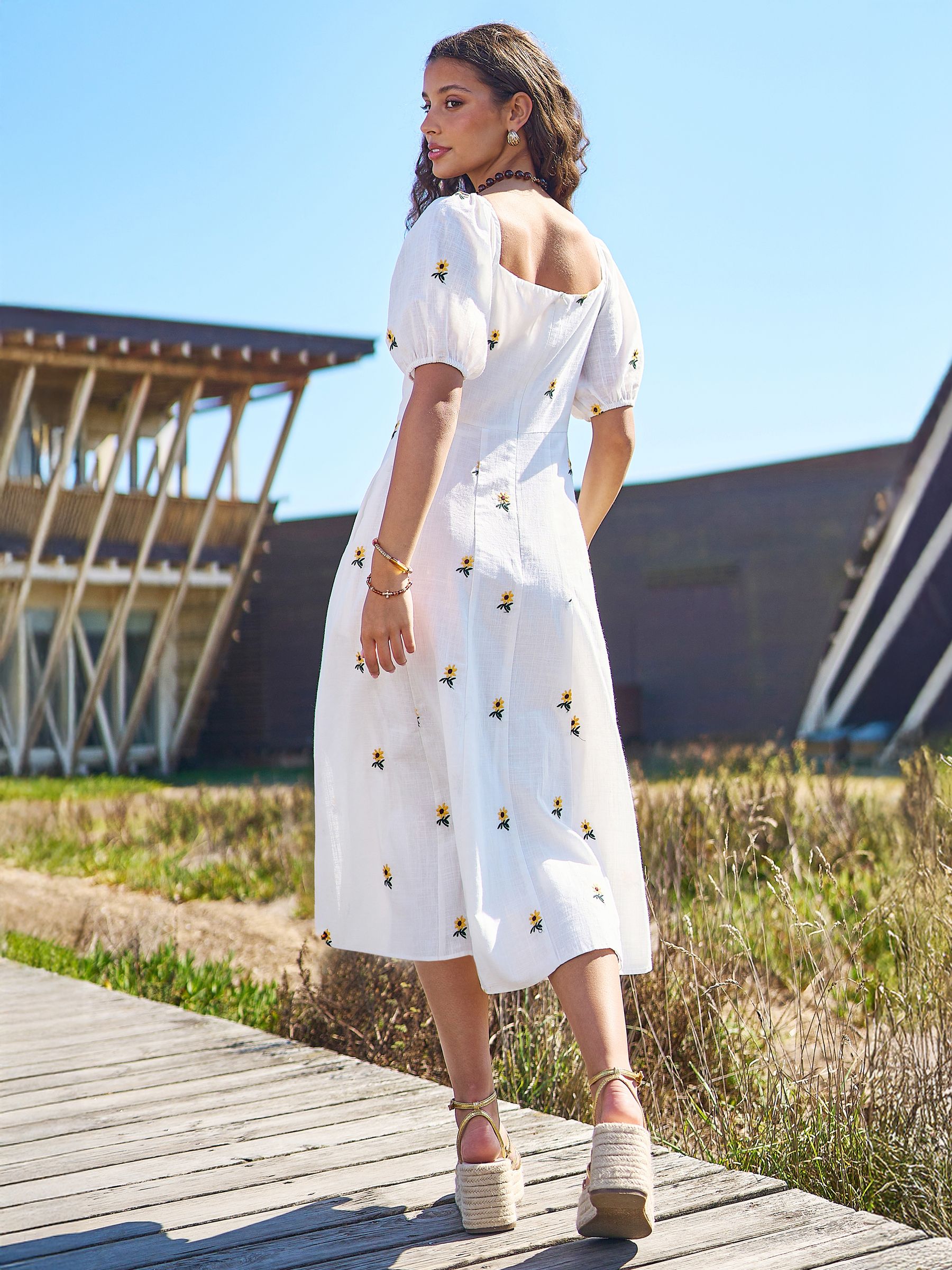 Buy Yumi White Cotton Sunflower Embroidered Midi Dress from the