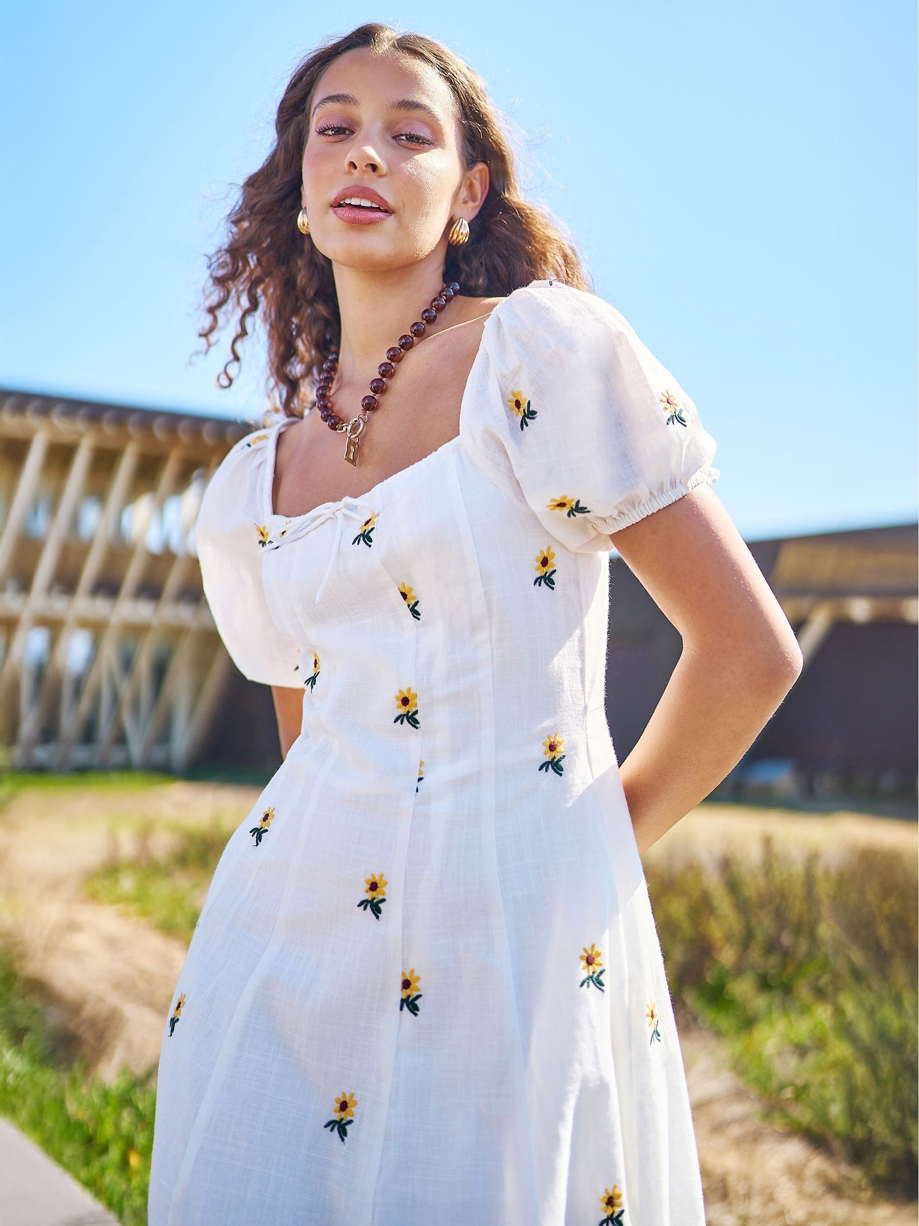 Buy Yumi White Cotton Sunflower Embroidered Midi Dress from the