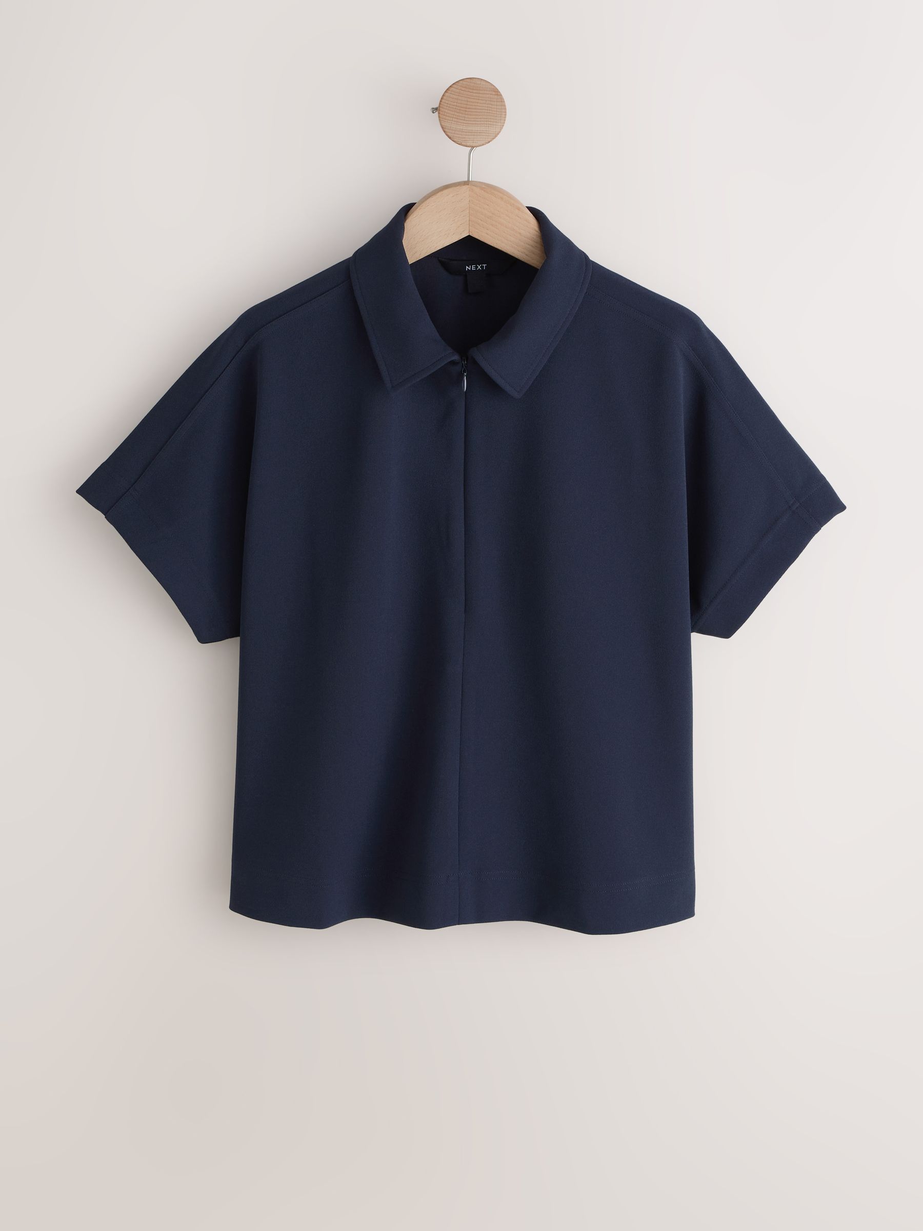 Buy Navy Blue Short Sleeved Polo Zip Top from the Next UK online shop