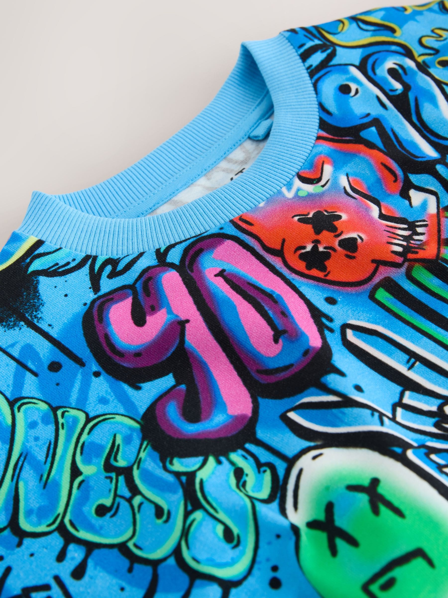 Buy Blue Graffiti Relaxed Fit Short Sleeve All-Over Print T-Shirt