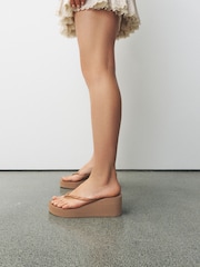 Camel Wedge Flip Flops - Image 1 of 9