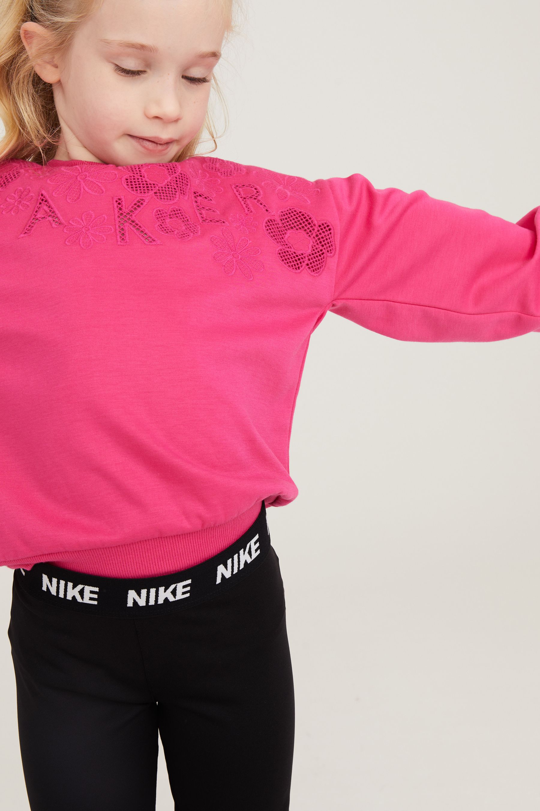 Nike training all sport leggings in black with mini swoosh 2025