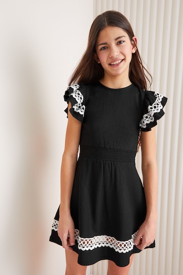 Lipsy Black/White Embroidered Ruffle Sleeve Dress (5-16yrs)