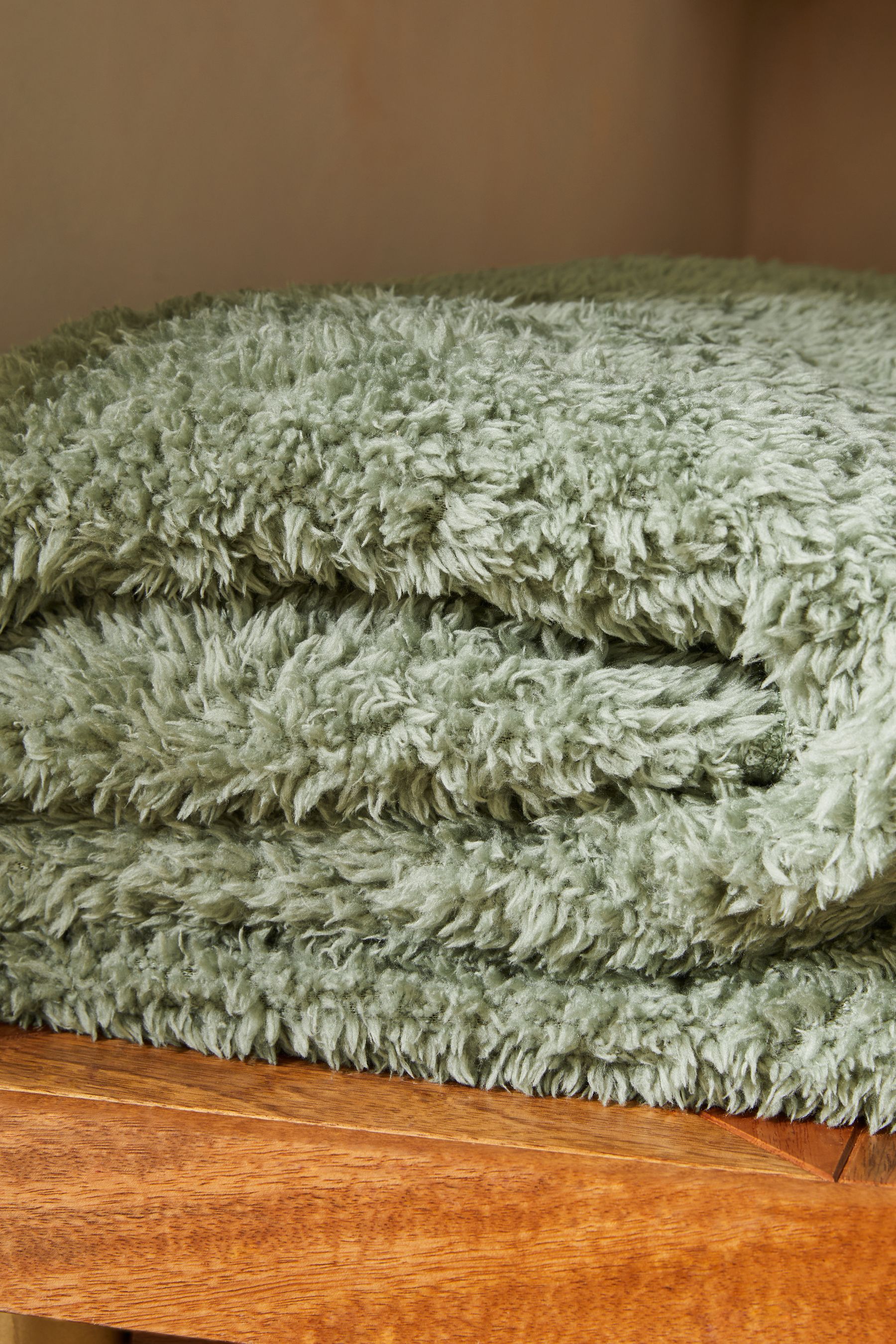 Buy Sage Green Snuggle Teddy Fleece Throw from Next Luxembourg