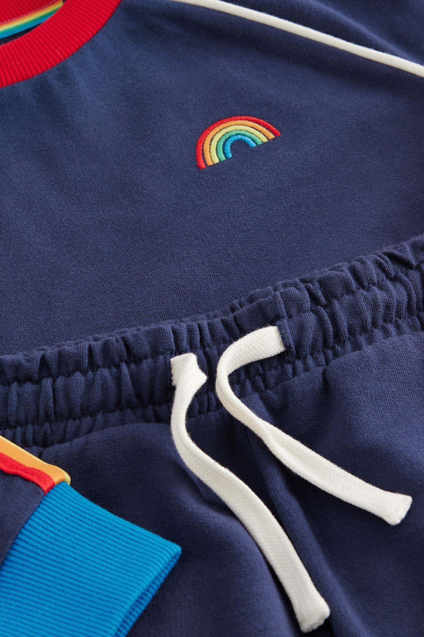 Buy Little Bird by Jools Oliver Navy Rainbow Sweatshirt and Jogger Set from Next Luxembourg