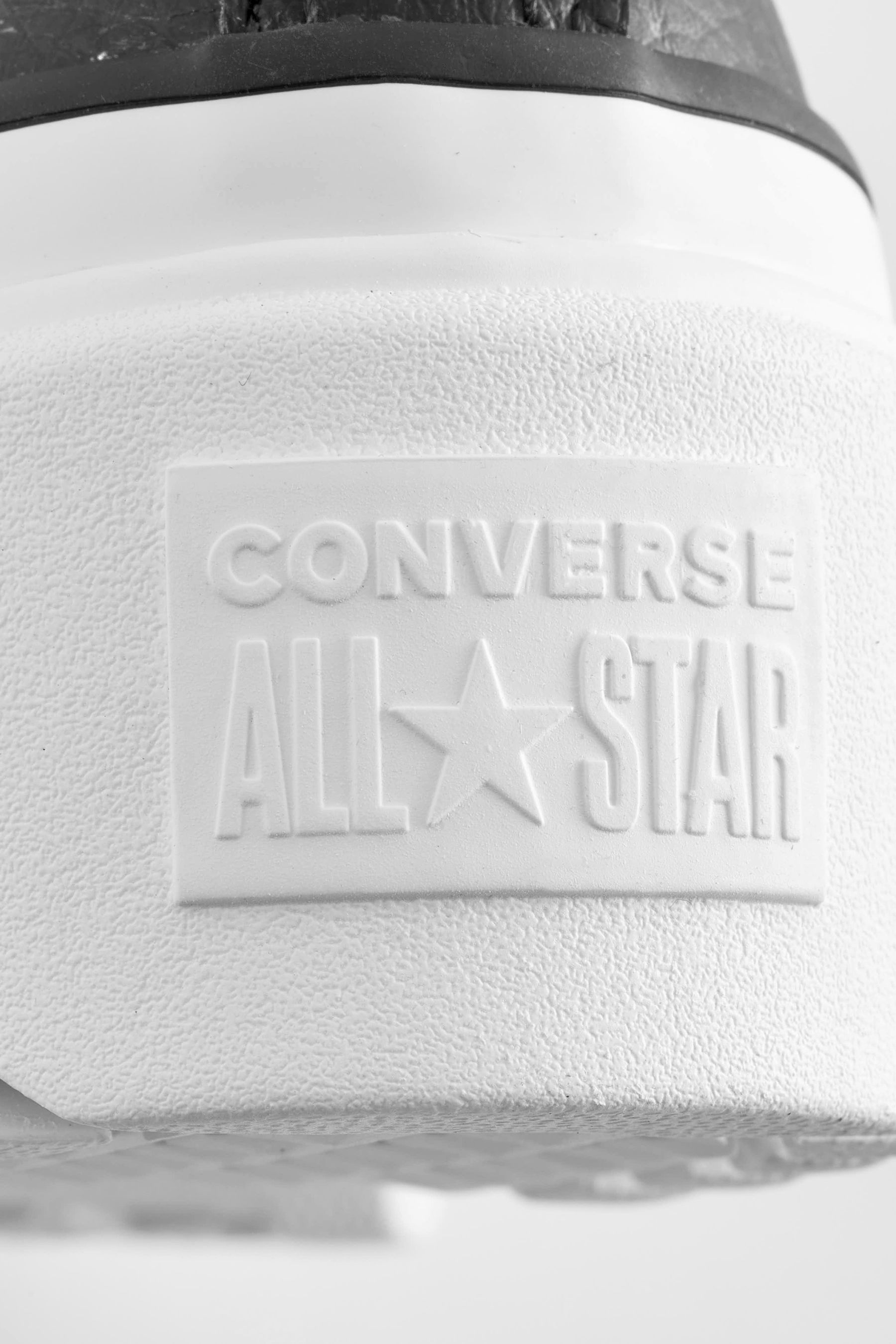 Buy Converse Black Lugged Leather Lift Junior Trainers from the