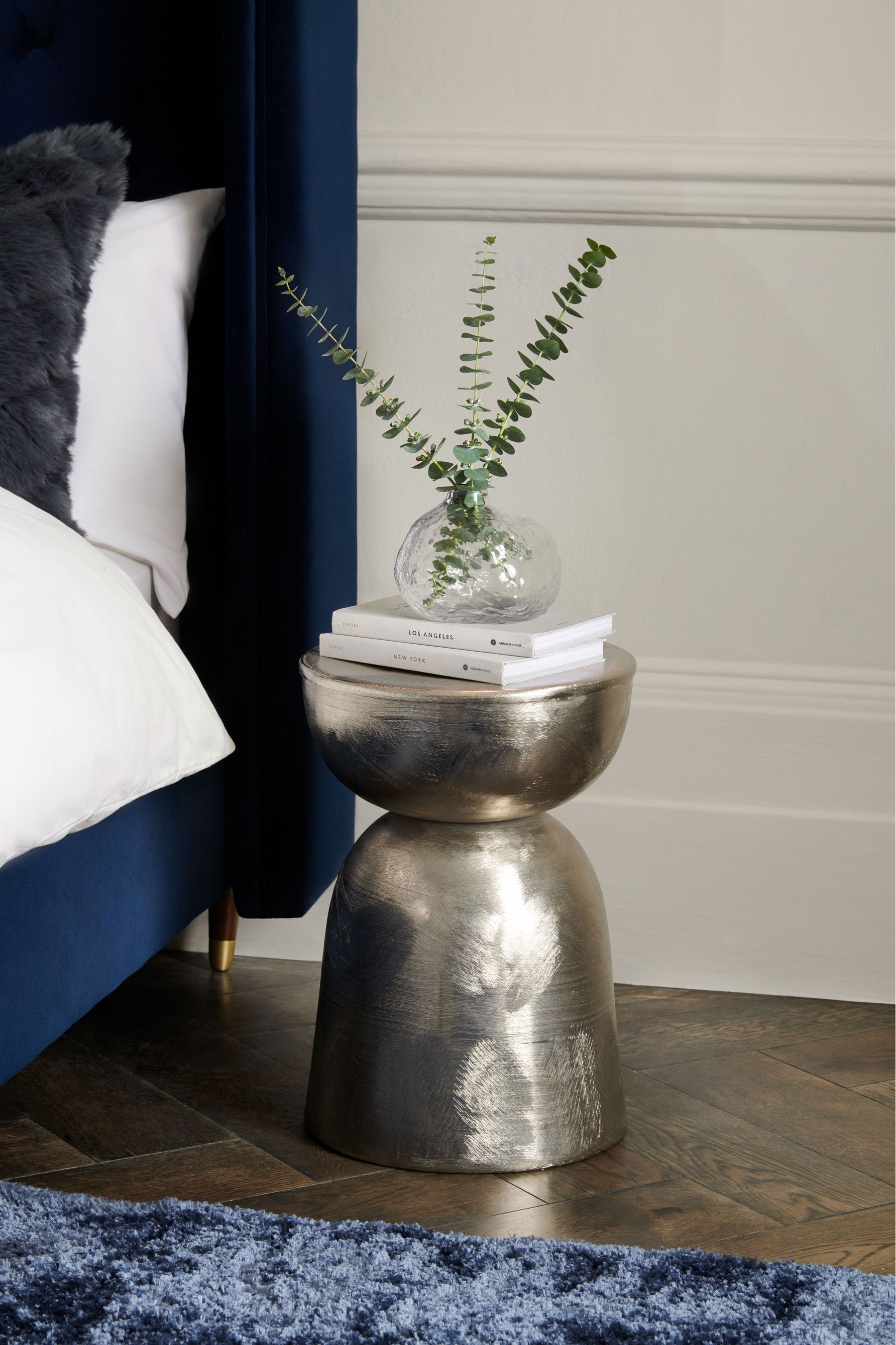 Silver metal drum coffee outlet table
