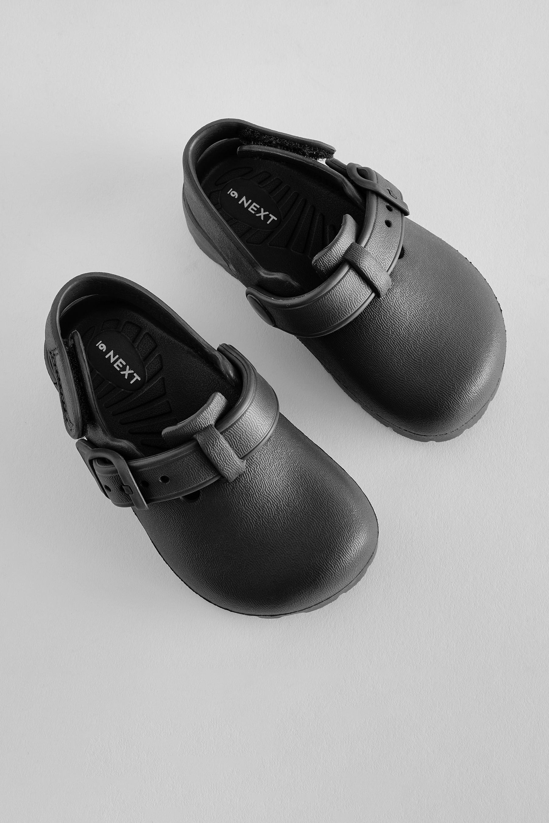 Black clogs with buckle top