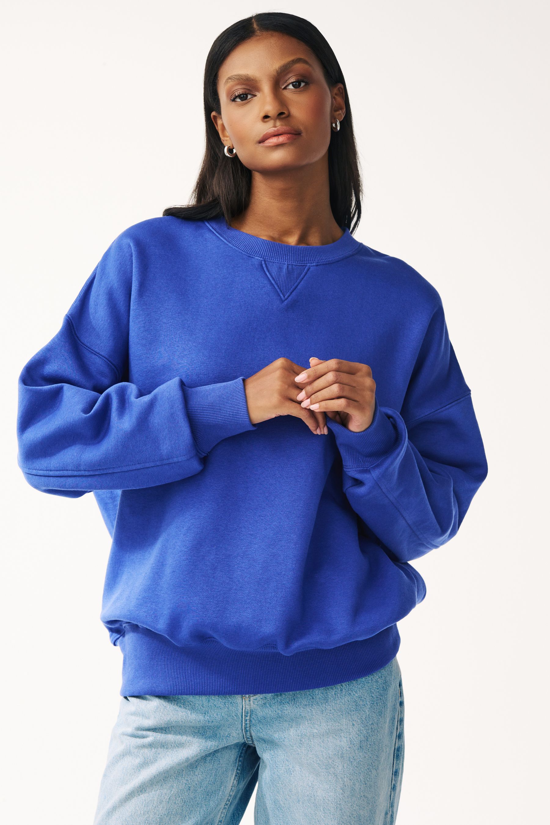 Buy Blue Oversized Heavyweight Brushed Longline Crew Neck Sweatshirt from Next Oman