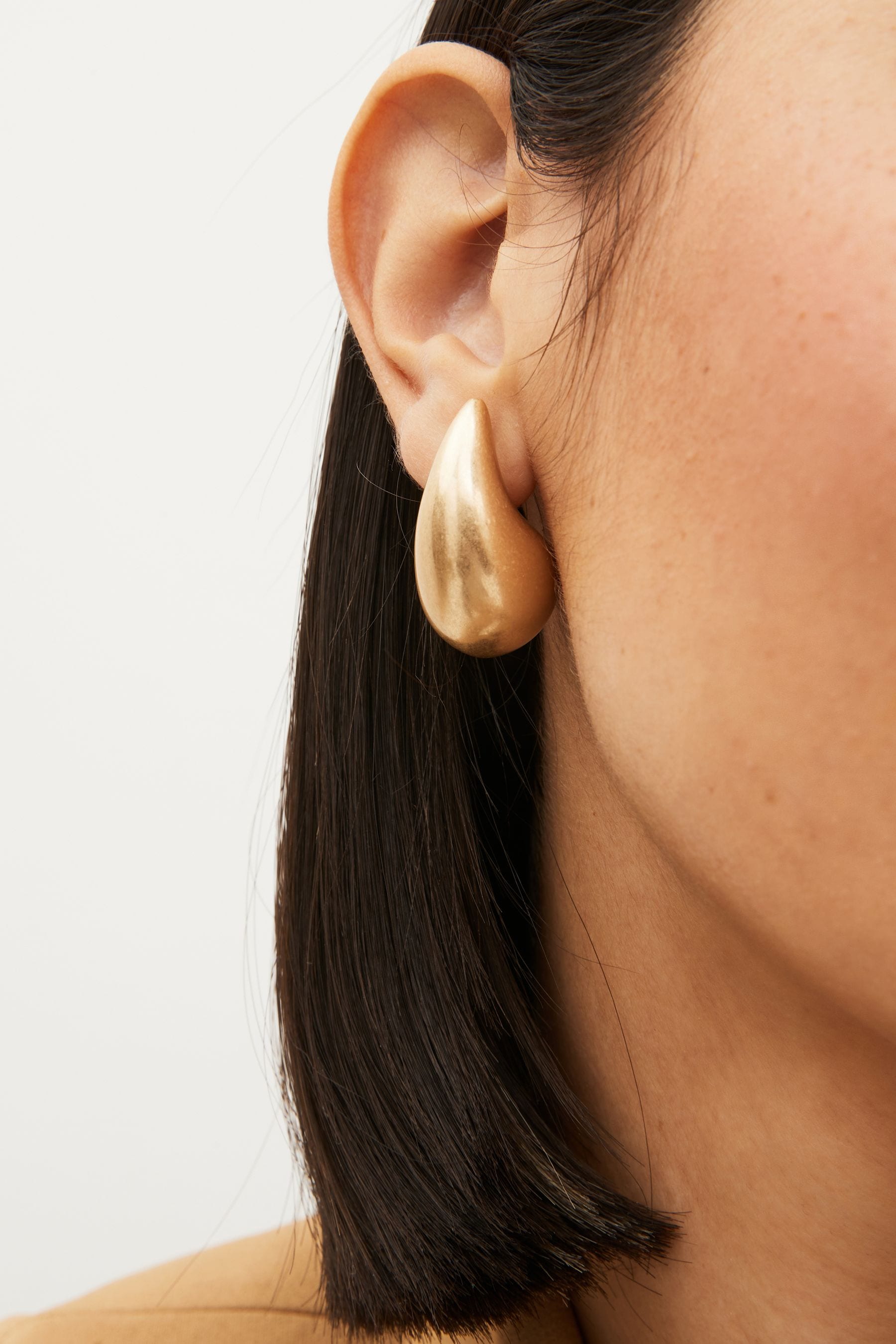 Statement studs earrings clearance