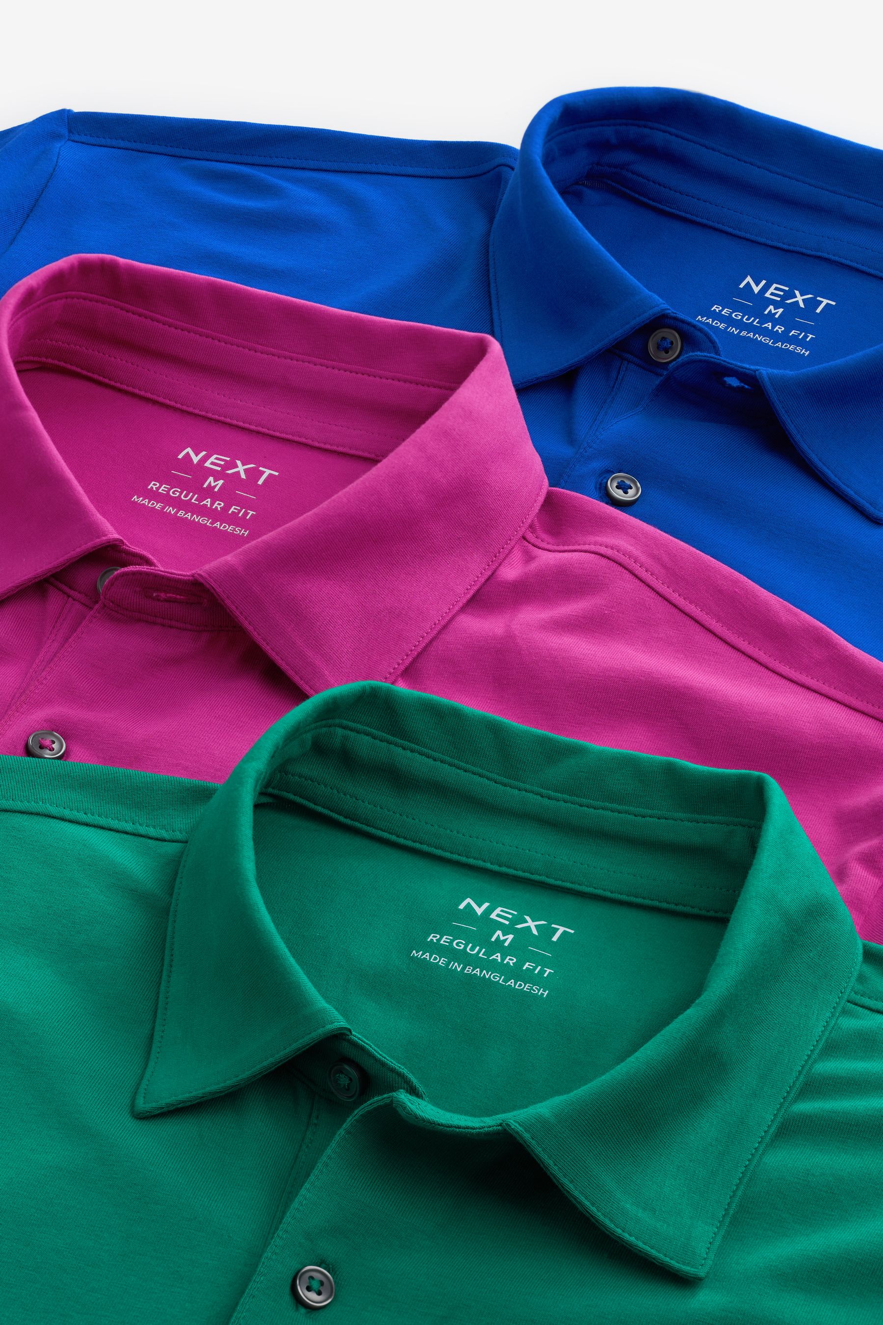 Buy Blue Green Pink Bright Regular Fit Short Sleeve Jersey Polo Shirts 3 Pack from Next Luxembourg