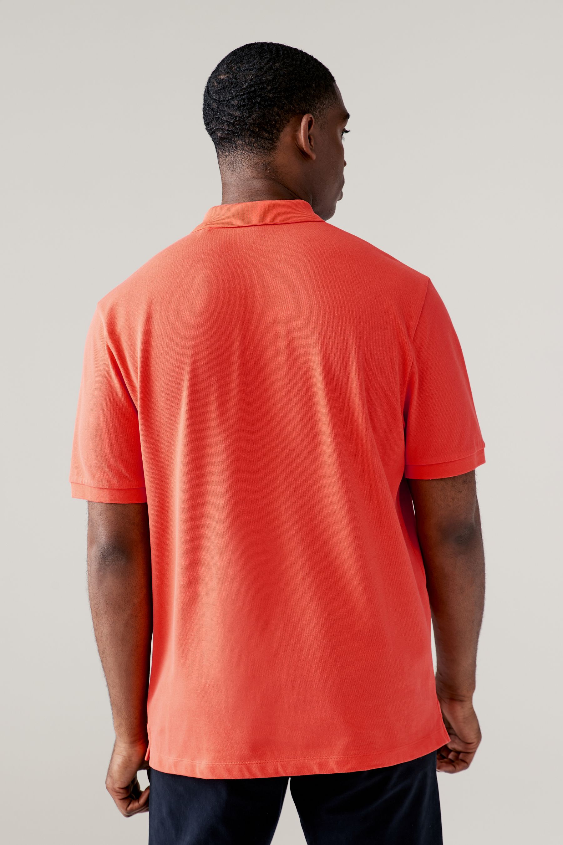 Bright orange polo shirt online