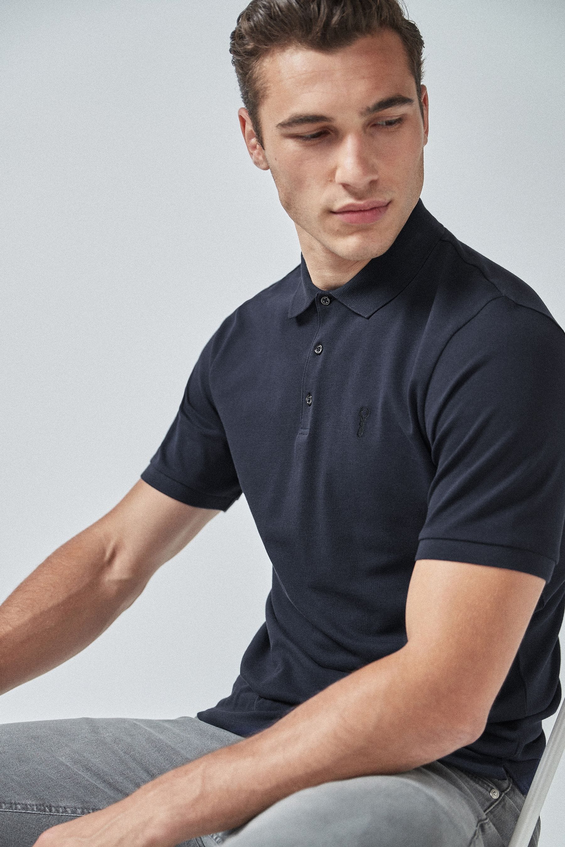 Buy Blue Navy Regular Fit Short Sleeve Pique Polo Shirt from the Next UK online shop